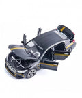 Masinuta metal mecanica, tip BMW M8 MANHART, 3 sunete, usi mobile, capota mobila, portbagaj mobil, negru, 22 cm