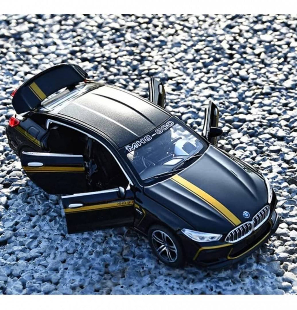 Masinuta metal mecanica, tip BMW M8 MANHART, 3 sunete, usi mobile, capota mobila, portbagaj mobil, negru, 22 cm